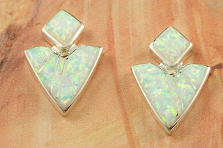 Fire and Ice Lab Opals inlaid between ribbons of Sterling Silver. Beautiful Sterling Silver Post Earrings feature precision channel inlay. Designed by Navajo Artist Calvin Begay. Signed.